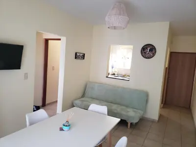 a living room with a couch and a table at Excelente departamento en zona céntrica. C/Cochera in Río Cuarto