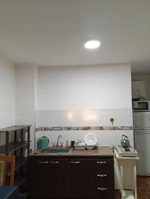 a kitchen with a sink and a counter top at Sierras Altas Alojamientos in Villa Carlos Paz