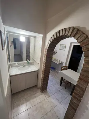 a bathroom with a sink and a mirror at Apartamento Nuevo Centro in Cordoba