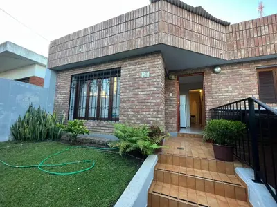 a brick house with a hose in the yard at Apartamento Nuevo Centro in Cordoba