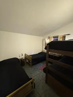a room with two bunk beds in a room at Casita de Cuesta in Villa Icho Cruz