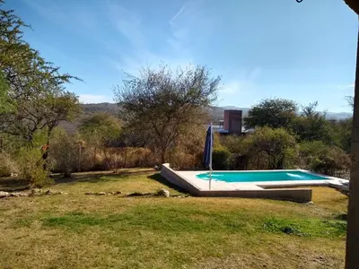 a swimming pool in the middle of a yard at Casa en Villa Los Aromos in La Bolsa