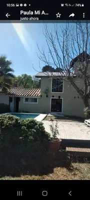 a picture of a house with a pool in front of it at Cabaña Paulina in Santa Rosa de Calamuchita