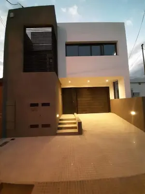 a house with a garage in front of it at COMPLEJO CRUZ in Alta Gracia