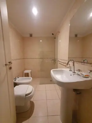 a bathroom with a sink and a toilet and a mirror at Locador Nueva Cordoba 11bi in Cordoba