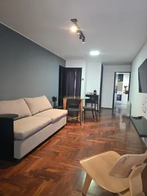 a living room with a couch and a table at LOCADOR Nueva Cordoba 3C in Cordoba