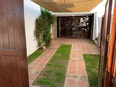 an entrance to a house with a brick walkway at LO DE CAPRETTA in Almafuerte