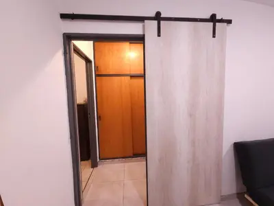 an open door to a room with a sliding glass door at Milca Celeste Nueva Córdoba in Cordoba