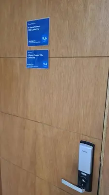 an apple cell phone is plugged into a wall at II Opera Towers Villa Carlos Paz in Villa Carlos Paz