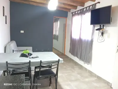 a dining room with a white table and chairs at Ohana in Cordoba