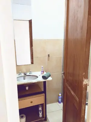 a bathroom with a sink and a mirror at Monoambiente para 2 personas con baño privado in Cordoba