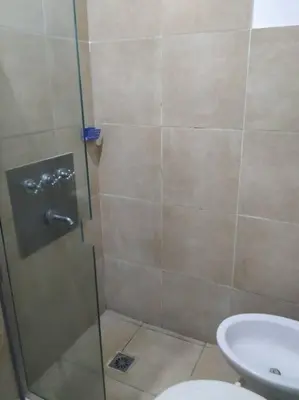 a bathroom with a shower with a toilet and a sink at Monoambiente para 2 personas con baño privado in Cordoba