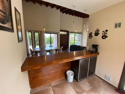 a kitchen with a wooden counter in a room at Andelka-Chumamaya Merlo San Luis in Merlo