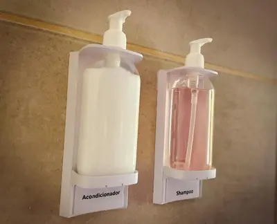 two bottles of soap are sitting on the floor at Andelka-Chumamaya Merlo San Luis in Merlo