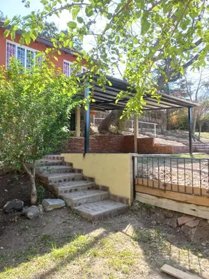 a set of stairs in front of a house at Complejo Los Manantiales in Alta Gracia