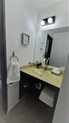 a bathroom with a sink and a mirror at Complejo Dos Osos in Villa General Belgrano