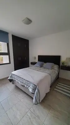a bedroom with a large bed in a room at Complejo Dos Osos in Villa General Belgrano