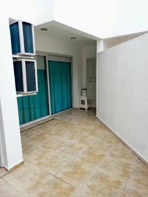 an empty room with a tile floor and windows at Apartamento Faro de General Paz in Cordoba