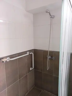 a bathroom with a shower with a glass door at Apartamento Faro de General Paz in Cordoba