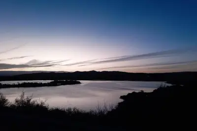 a view of a body of water at sunset at La Lola in Villa del Dique
