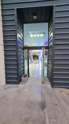 an entrance to a building with the door open at Confort Río Cuarto I in Río Cuarto