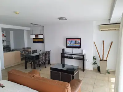 a living room with a couch and a table at Coral State Loft in Tower in Cordoba