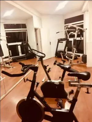 a gym with two exercise bikes in a room at Coral State Loft in Tower in Cordoba
