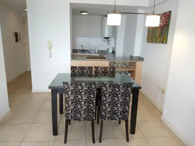 a kitchen with a dining table and chairs at Coral State Loft in Tower in Cordoba