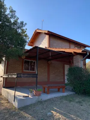 a house with a bench in front of it at Malenka in Pantanillo