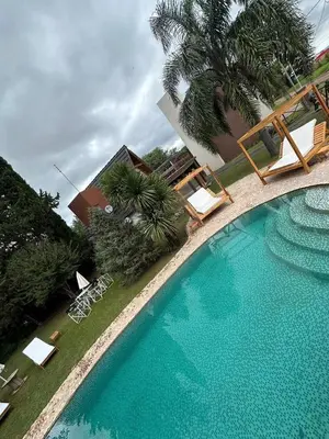an overhead view of a swimming pool in a resort at Dinastie Country in Villa Rumipal
