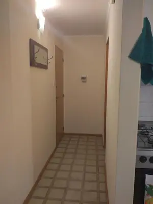 a hallway leading to a room with a stove at Departamento en Nueva Córdoba in Cordoba