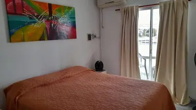 a bedroom with a bed and a painting on the wall at CELESTINA in Cordoba