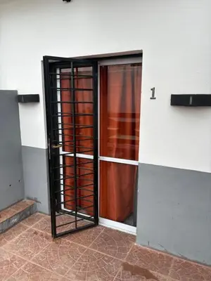 an open door to a room with a glass door at Departamento Genaro in Mina Clavero