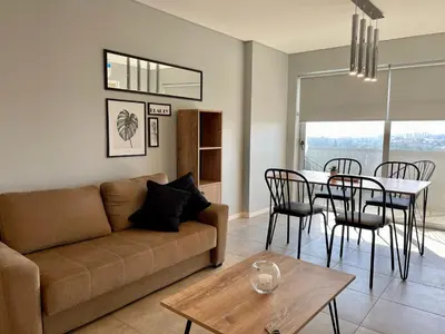 a living room with a couch and a table at Rent a Flat - Río Cuarto in Río Cuarto