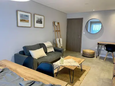 a living room with a couch and a table at Rent a Flat - Río Cuarto in Río Cuarto