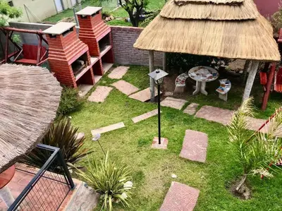 an aerial view of a garden with a thatch roof at LA MILAGROS PIQUITO DE ORO in Merlo