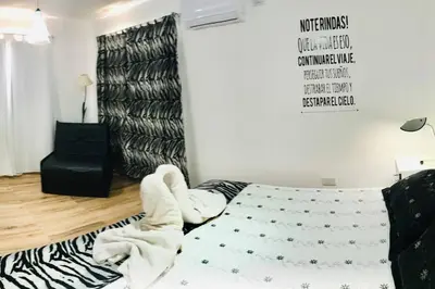 a bedroom with a bed with a mattressigunigunigun at LA MILAGROS PIQUITO DE ORO in Merlo