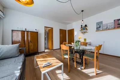 a living room with a table and a couch at Entre Ríos 73 - B Centro in Cordoba