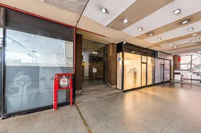a large room with glass doors in a building at Entre Ríos 73 - B Centro in Cordoba