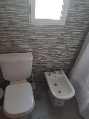 a bathroom with a toilet and a sink at LA MILAGROS ZORZAL COLORADO in Merlo