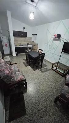 a room with couches and a table in a room at LUSANYUN in Villa Carlos Paz