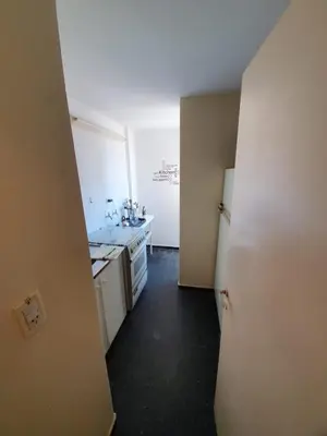 a kitchen with white appliances and a white refrigerator at Dpto Cordoba Capital in Cordoba