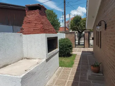 a brick chimney on the side of a building at Aire Serrano in Alta Gracia