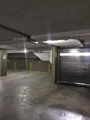 an empty parking lot with a garage door at Departamento céntrico Villa Carlos Paz in Villa Carlos Paz