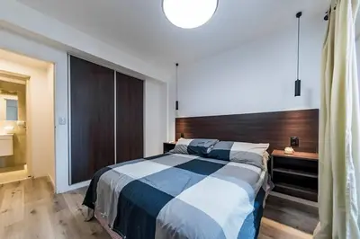 a bedroom with a bed and a large window at San Luis 61 B Nueva Córdoba enfrente al Paseo del Buen Pastor in Cordoba