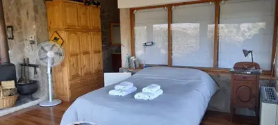 a bedroom with a bed with two towels on it at Casa Desconectar in Villa Berna