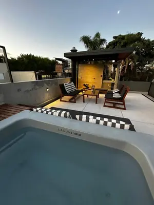 a swimming pool on the roof of a house at Loft 1930 in Villa Carlos Paz