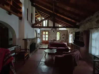 a living room with a couch and a fireplace at Casa Soleares in Villa de Las Rosas