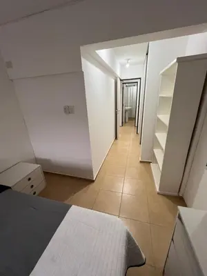 a room with a bed and a hallway with shelves at Castel Di Lucio 6 - Pleno centro Cba - in Cordoba