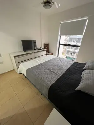 a bedroom with a large bed and a television at Castel Di Lucio 6 - Pleno centro Cba - in Cordoba
